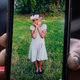 A relative holds up a cell phone with a photo of Fanta Bility. Fanta, 8, who was killed in Sharon Hill during a shooting on Aug. 27.